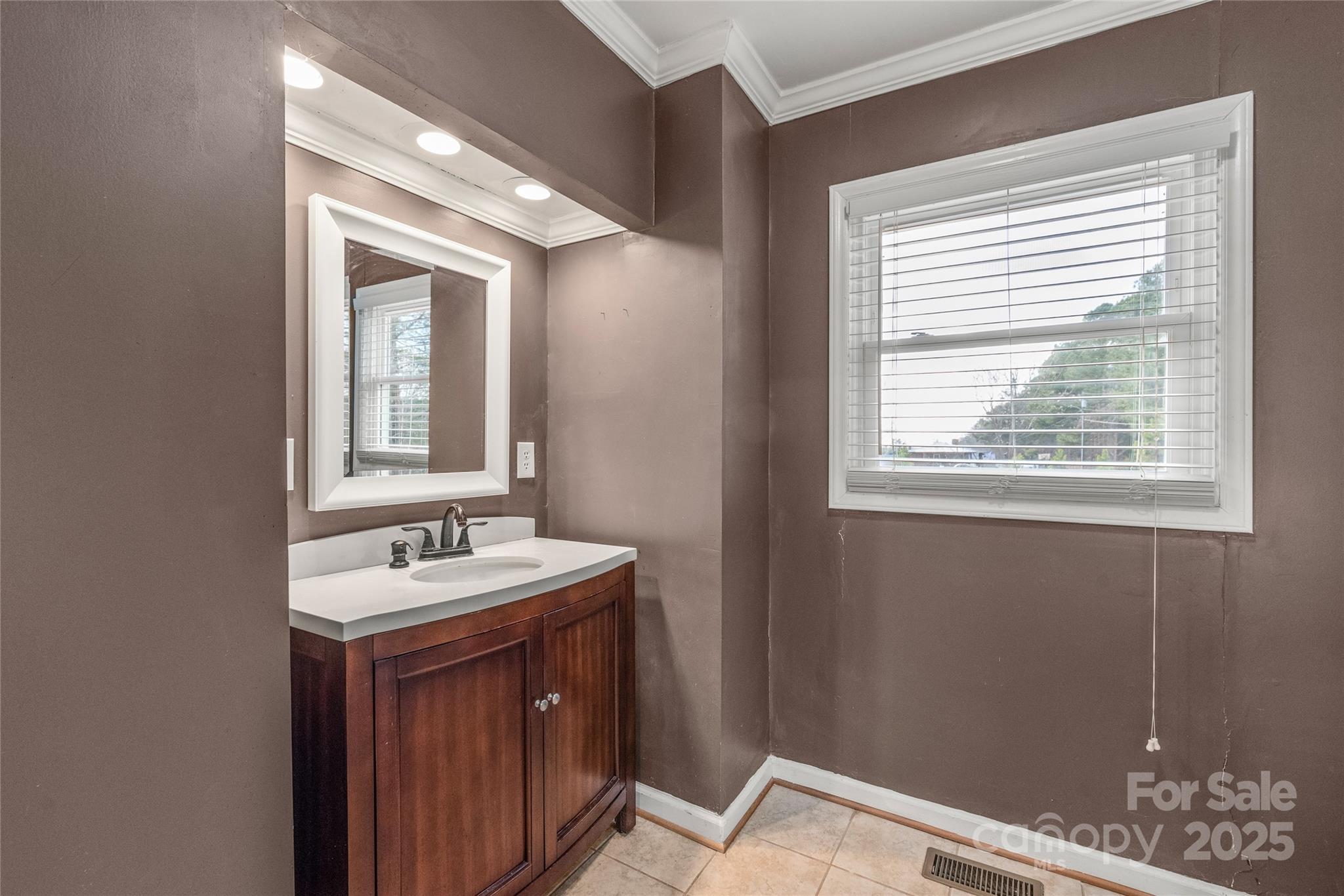 3933 Fallston-Waco Road Lawndale, NC 28090 - Photo 24 of 48 a bathroom with a sink and a mirror