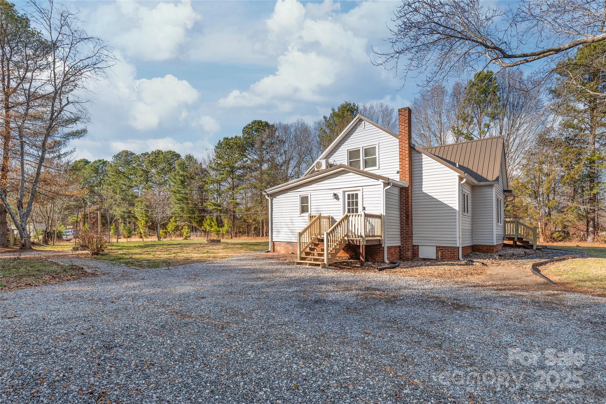 3933 Fallston-Waco Road Lawndale, NC 28090 - Photo 33 of 48 a view of the house with a yard and large trees
