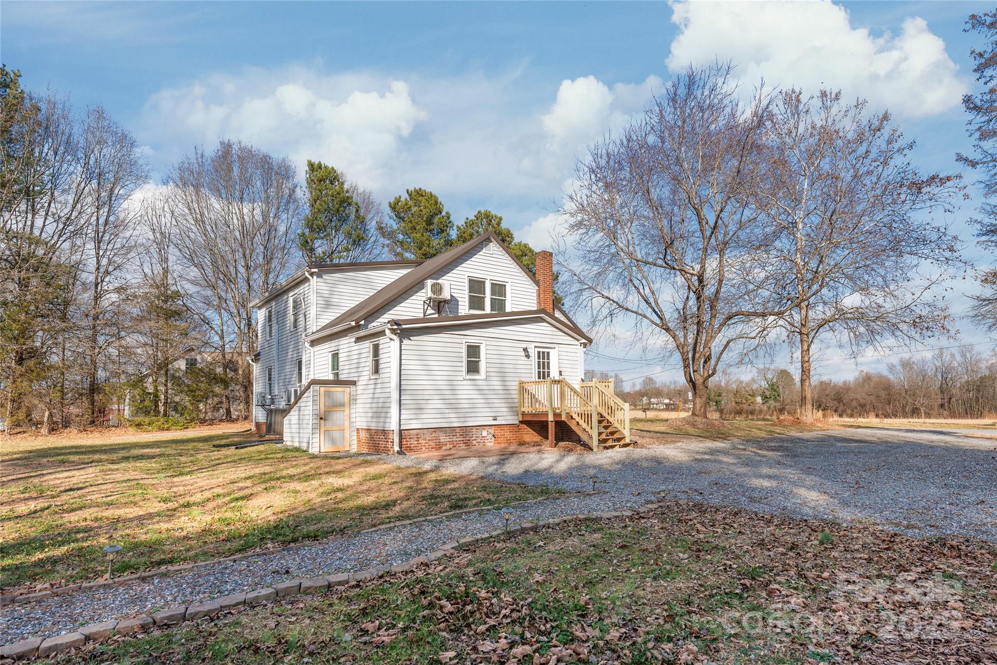 3933 Fallston-Waco Road Lawndale, NC 28090 - Photo 34 of 48 a view of house with yard and trees in the background