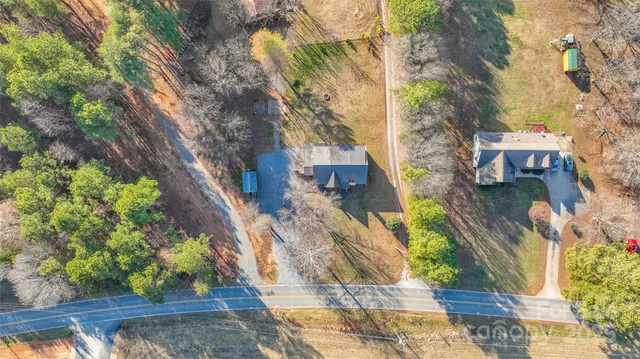 a aerial view of a house with a yard