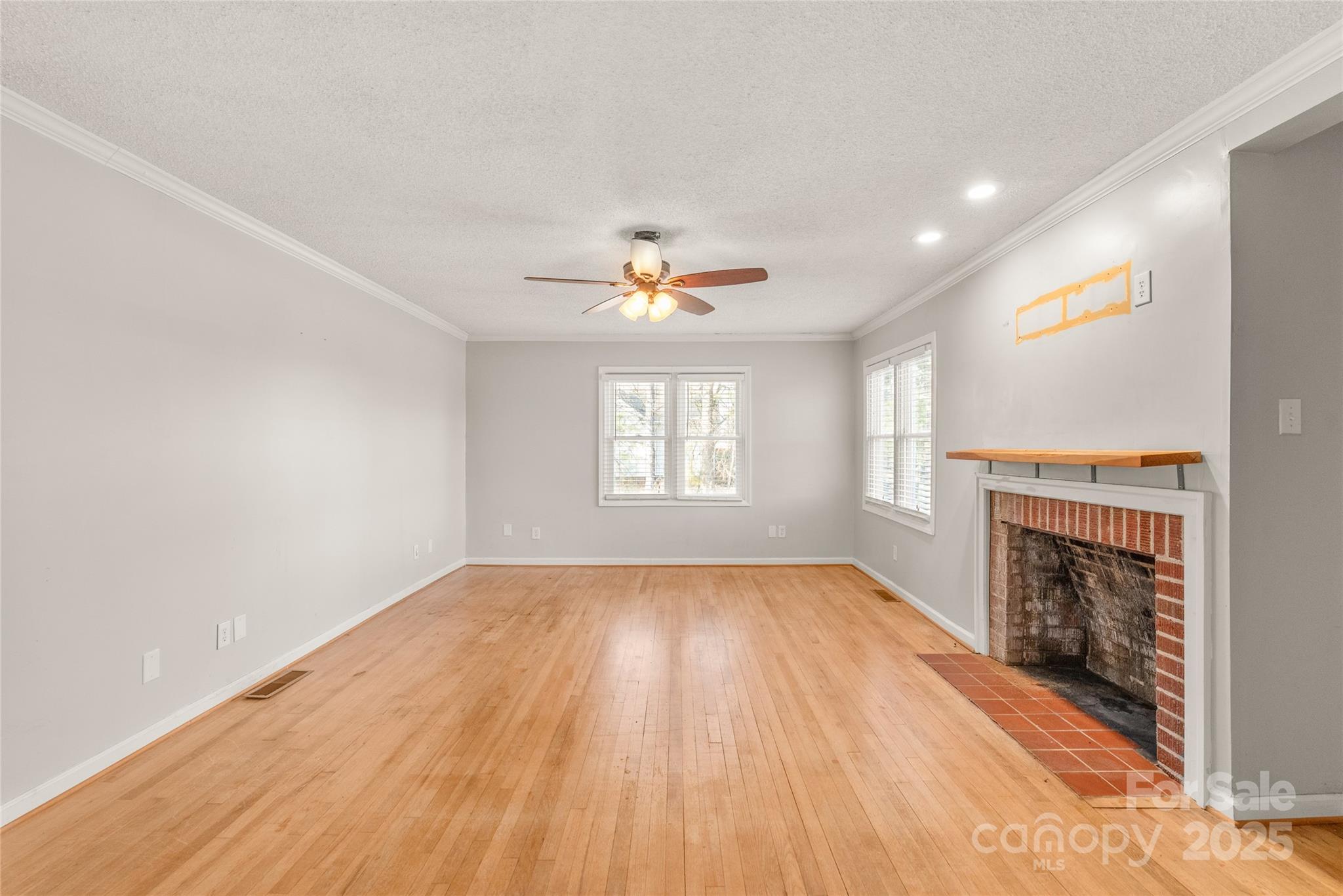 3933 Fallston-Waco Road Lawndale, NC 28090 - Photo 5 of 48 an empty room with windows and fireplace