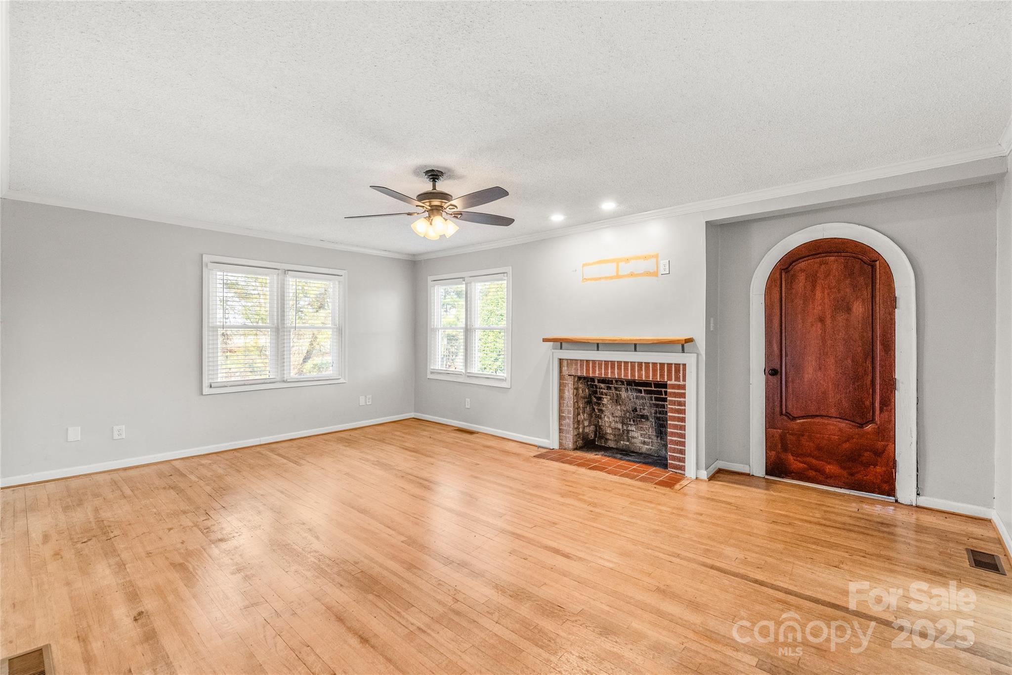 3933 Fallston-Waco Road Lawndale, NC 28090 - Photo 6 of 48 a view of empty room with fireplace and windows