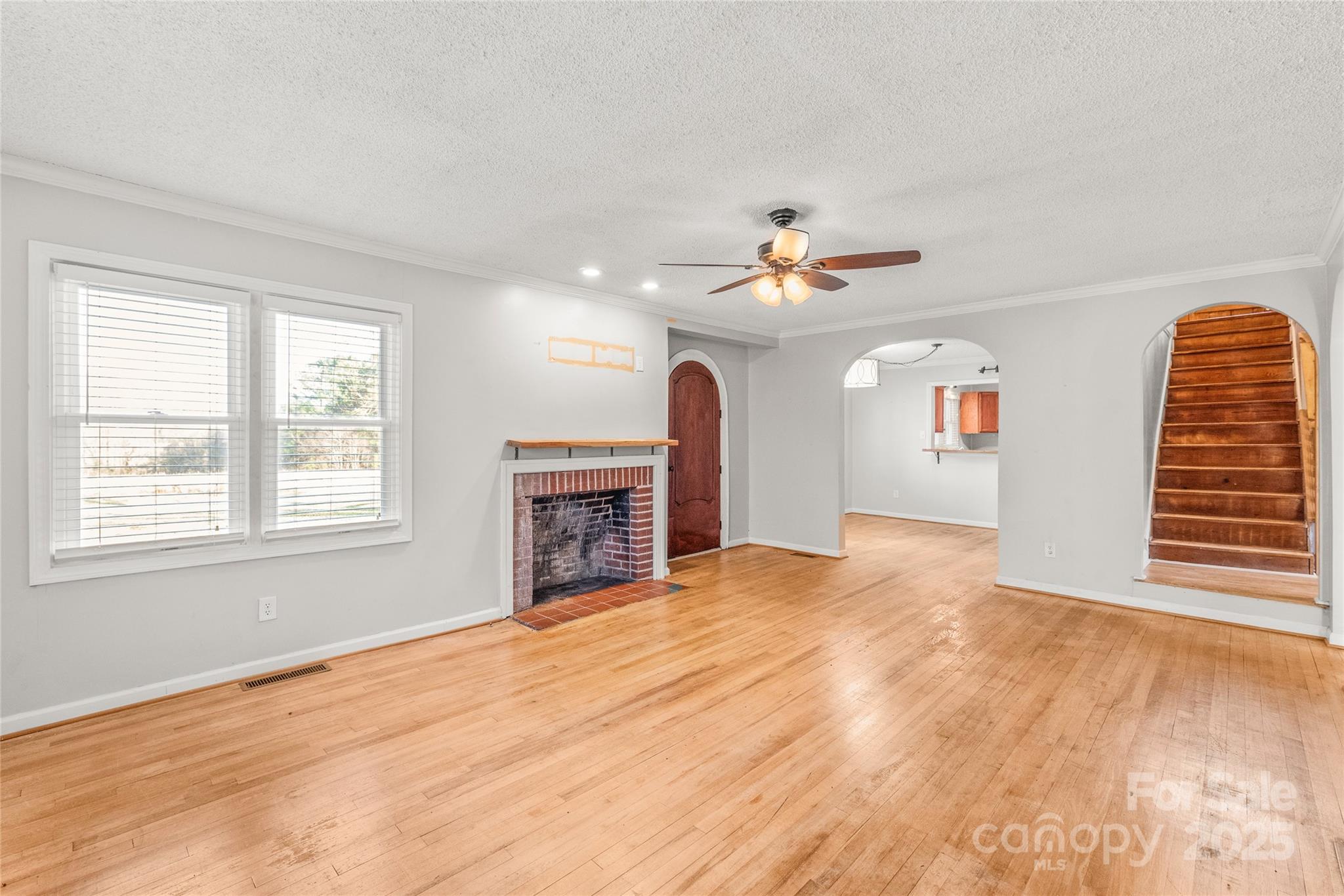 3933 Fallston-Waco Road Lawndale, NC 28090 - Photo 7 of 48 wooden floor in an empty room with a fireplace
