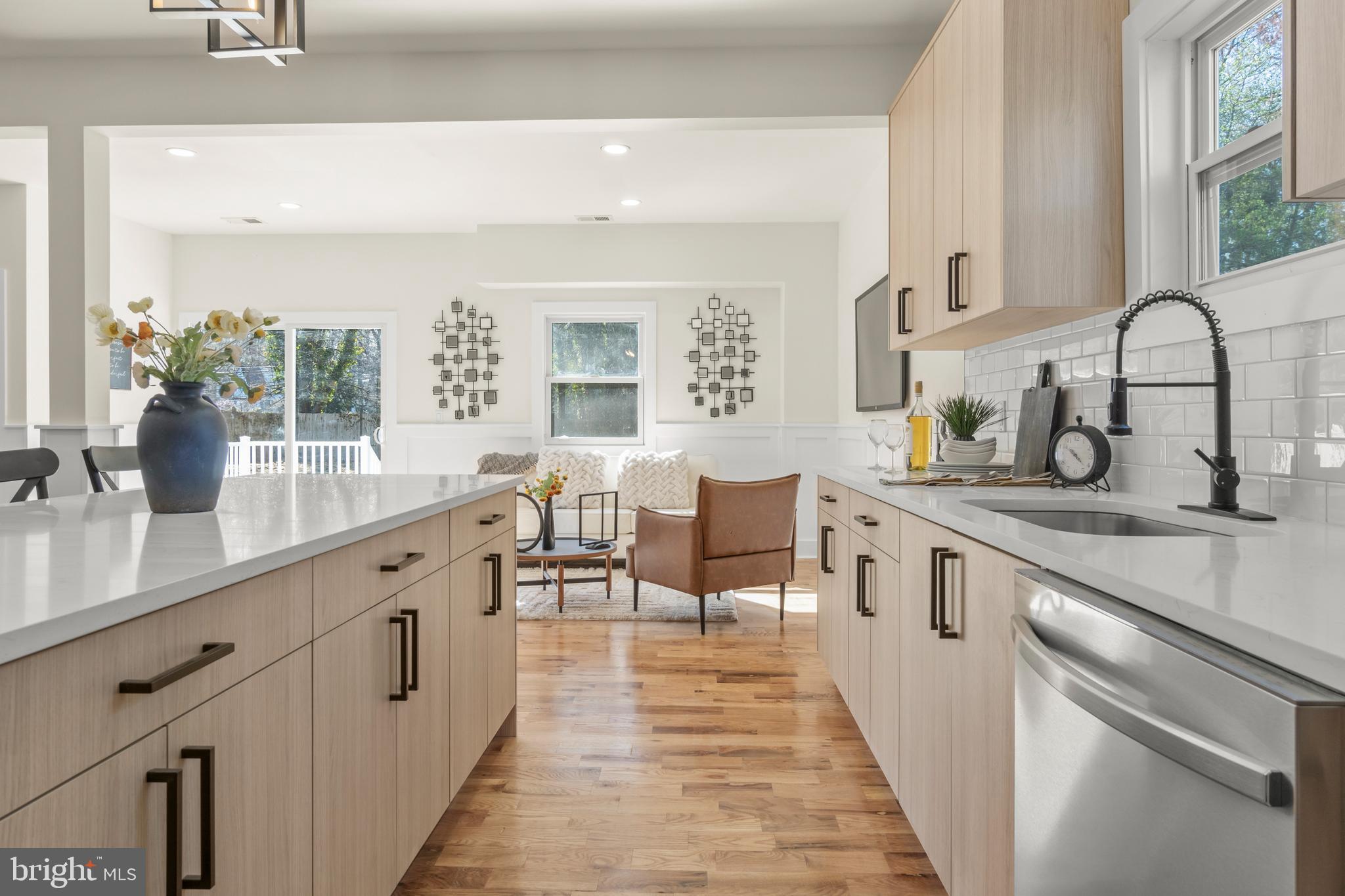 32 Wagon Bridge Run Moorestown, NJ 08057 - Photo 19 of 41 a open kitchen with stainless steel appliances granite countertop a sink and dishwasher a stove with wooden floors