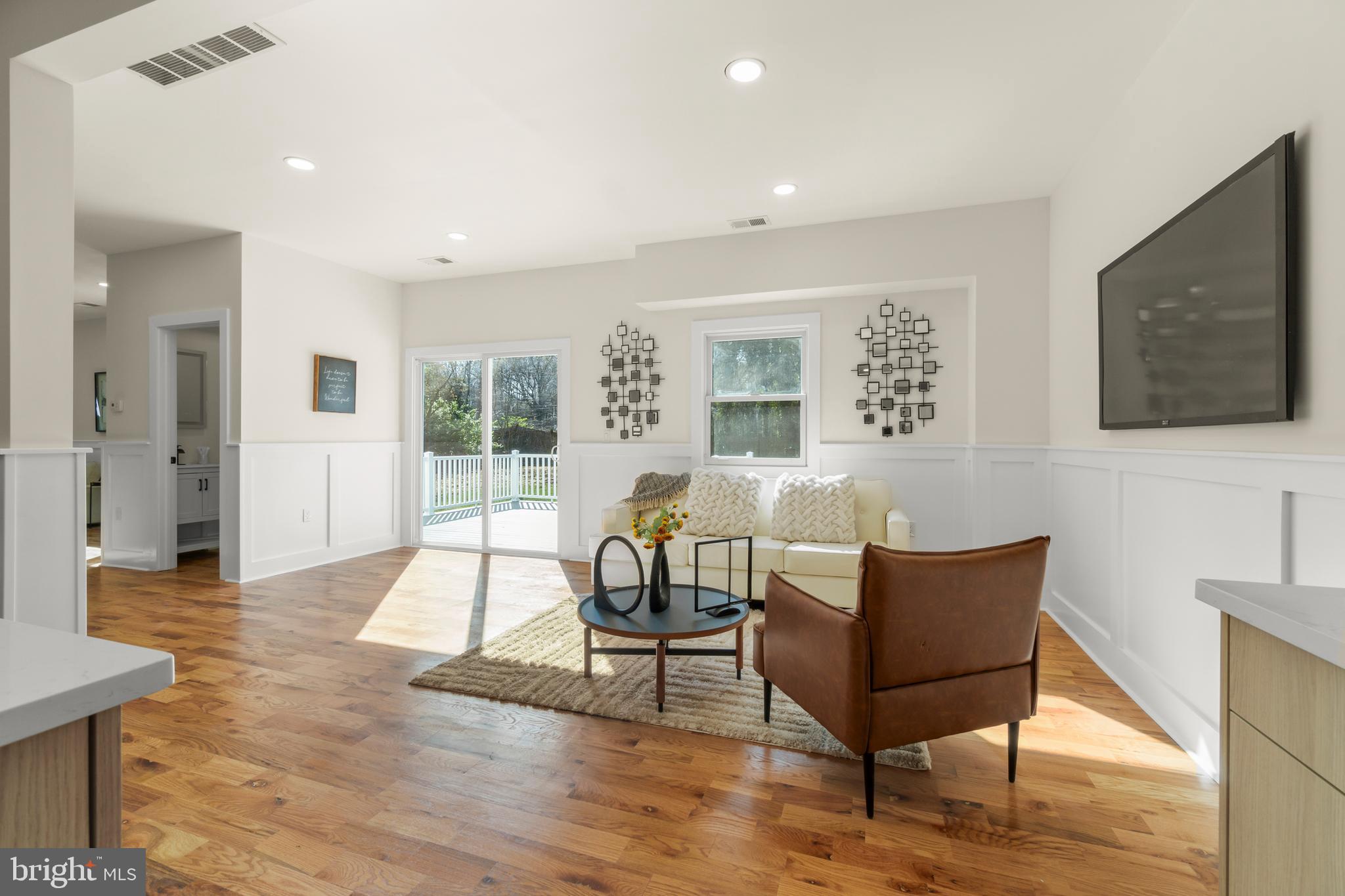 32 Wagon Bridge Run Moorestown, NJ 08057 - Photo 20 of 41 a living room with furniture a flat screen tv and a table