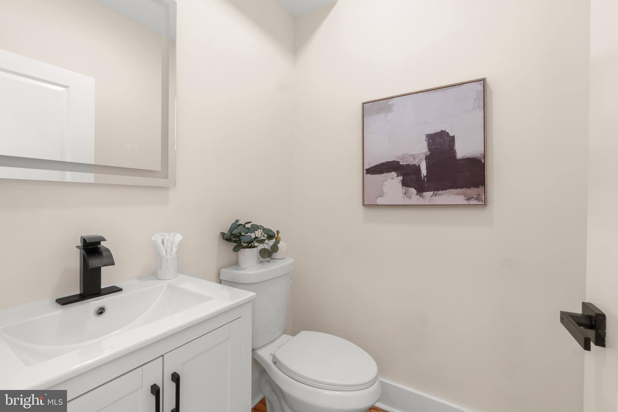 32 Wagon Bridge Run Moorestown, NJ 08057 - Photo 27 of 41 a bathroom with a toilet sink and mirror