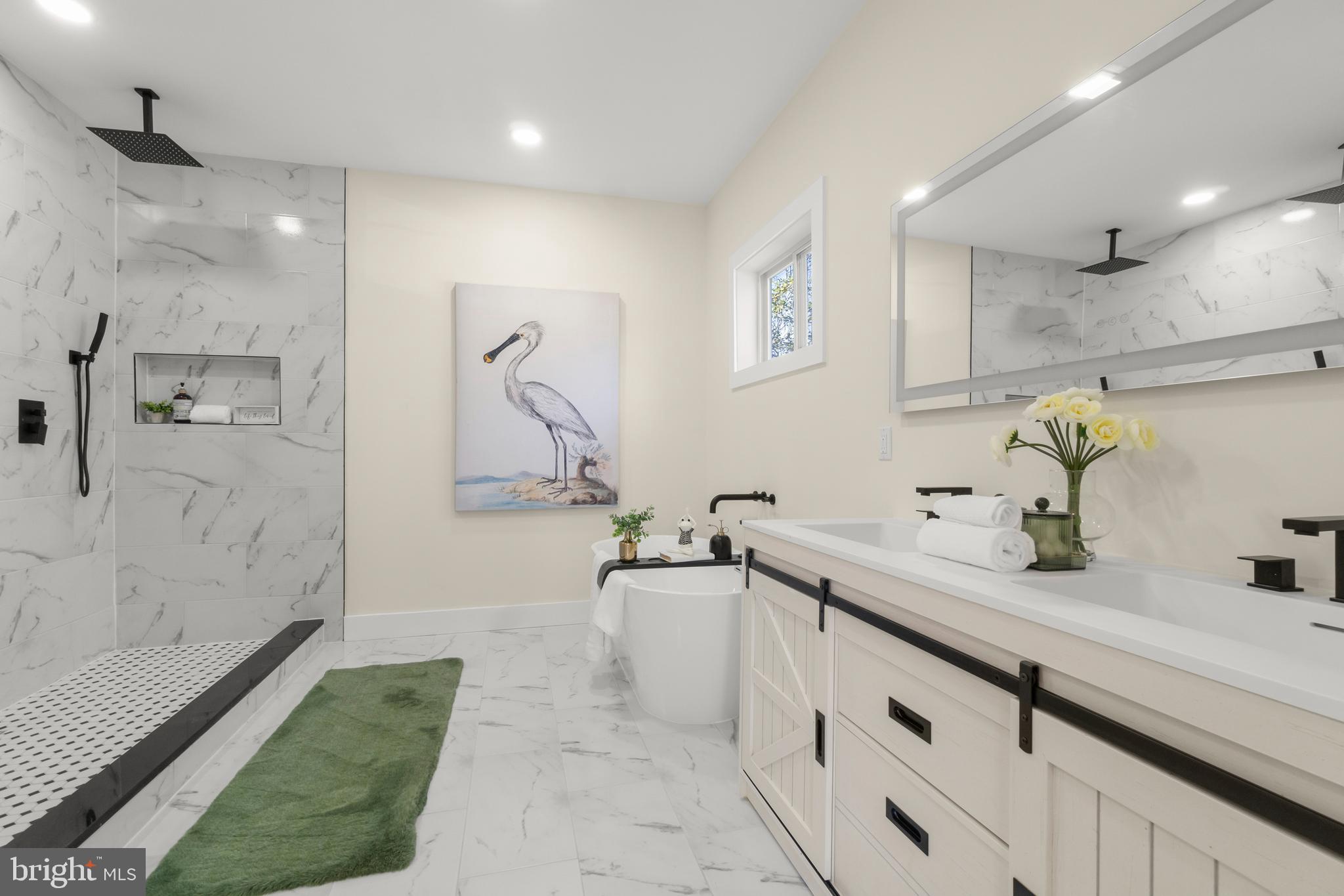 32 Wagon Bridge Run Moorestown, NJ 08057 - Photo 36 of 41 a spacious bathroom with a tub sink and mirror