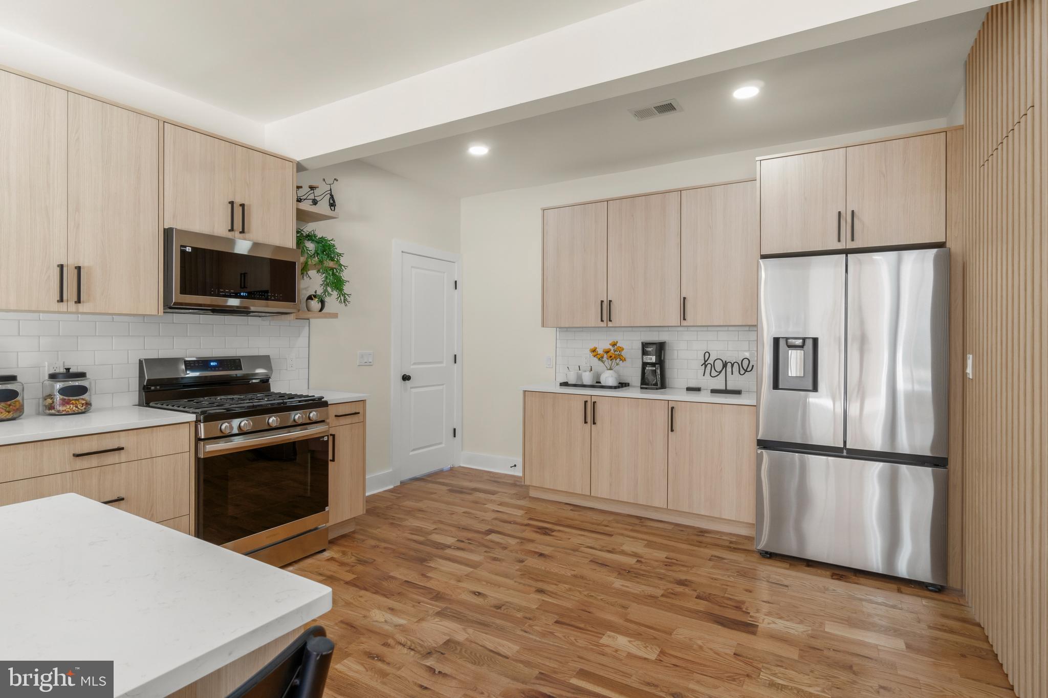 32 Wagon Bridge Run Moorestown, NJ 08057 - Photo 5 of 41 a kitchen with white cabinets and stainless steel appliances