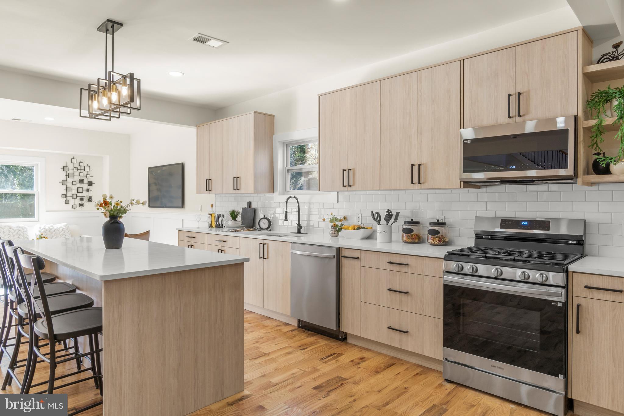 32 Wagon Bridge Run Moorestown, NJ 08057 - Photo 7 of 41 a kitchen with stainless steel appliances a sink stove and microwave