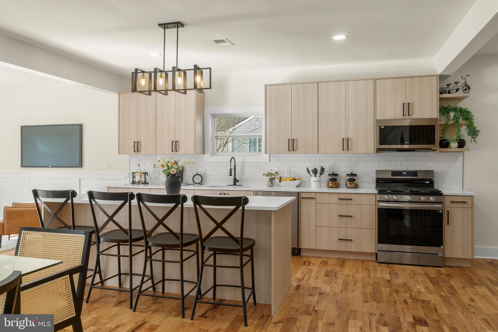 32 Wagon Bridge Run Moorestown, NJ 08057 - Photo 10 of 41 a kitchen with stainless steel appliances kitchen island granite countertop a sink and cabinets