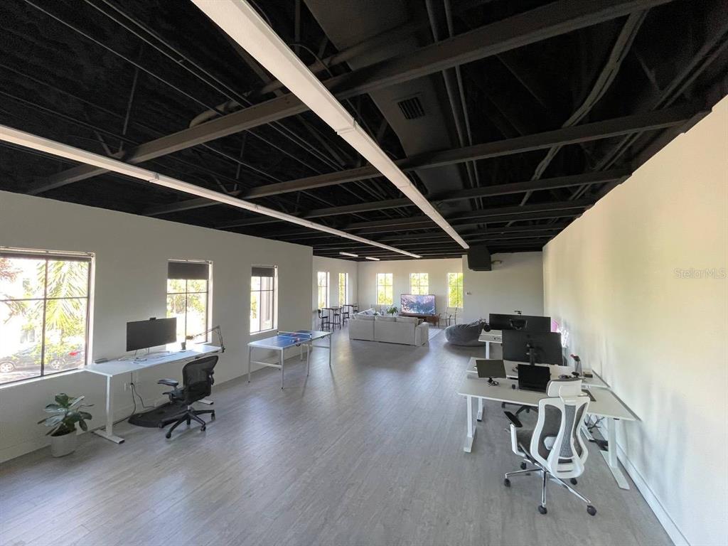 5900 Pan American Boulevard, Unit 205 North Port, FL 34287 - Photo 2 of 8 a lobby with furniture and wooden floor