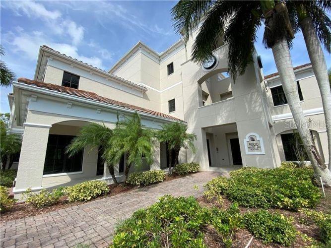 5900 Pan American Boulevard, Unit 205 North Port, FL 34287 - Photo 7 of 8 a front view of a house with a garden