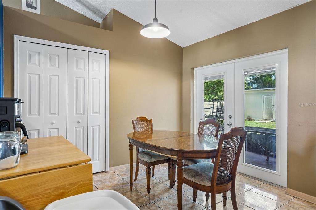 10303 Fordham Street Spring Hill, FL 34608 - Photo 8 of 25 a view of a dining room with furniture window and outside view