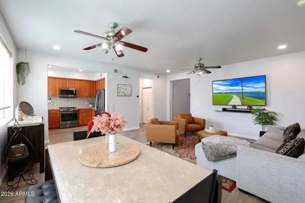 a living room with furniture and a flat screen tv