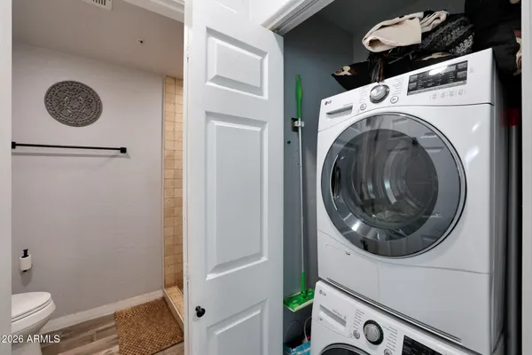 a close view of a utility room with dryer and washer