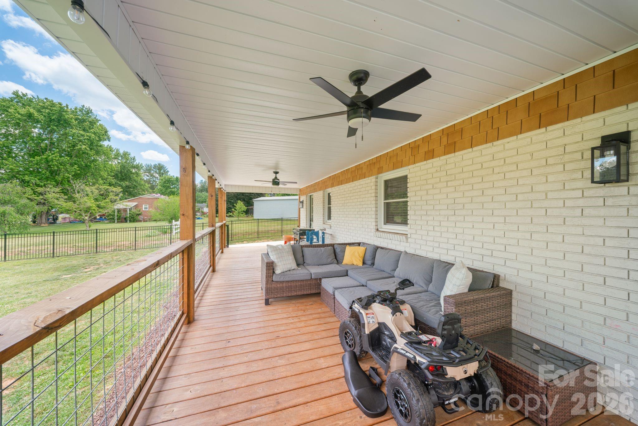 97 Paul Holland Road Canton, NC 28716 - Photo 29 of 35 a view of a deck with furniture and a backyard
