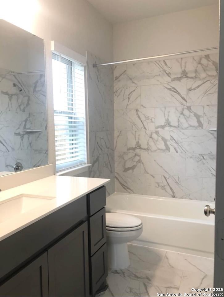 9358 Boiling Rapid San Antonio, TX 78254 - Photo 14 of 22 a bathroom with a sink a toilet and a bathtub