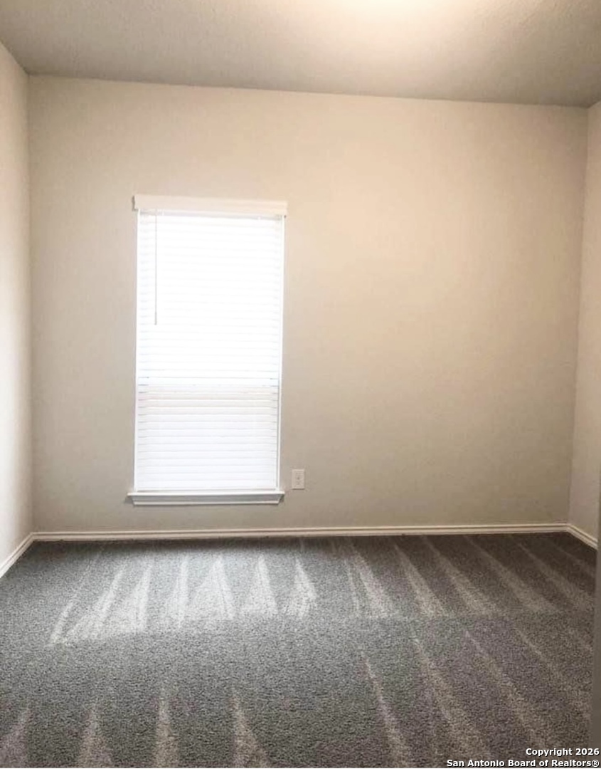 9358 Boiling Rapid San Antonio, TX 78254 - Photo 16 of 22 an empty room with a window