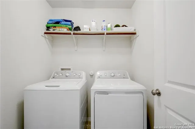 a utility room with dryer and washer
