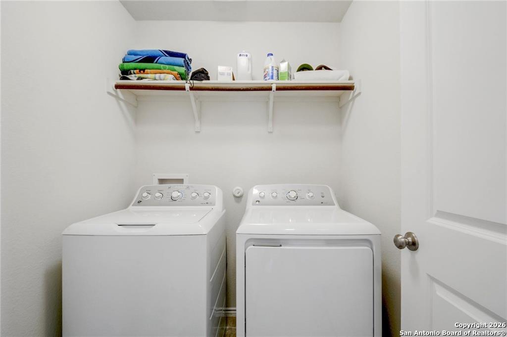 9358 Boiling Rapid San Antonio, TX 78254 - Photo 17 of 22 a utility room with dryer and washer