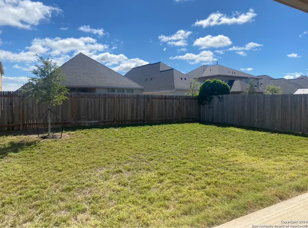 a swimming pool with wooden fence