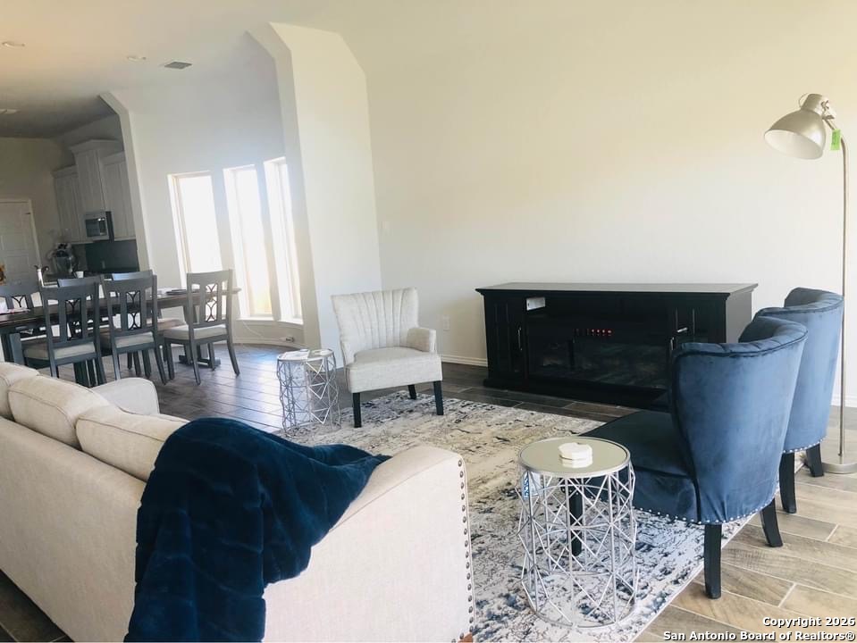9358 Boiling Rapid San Antonio, TX 78254 - Photo 2 of 22 a living room with furniture and a fireplace