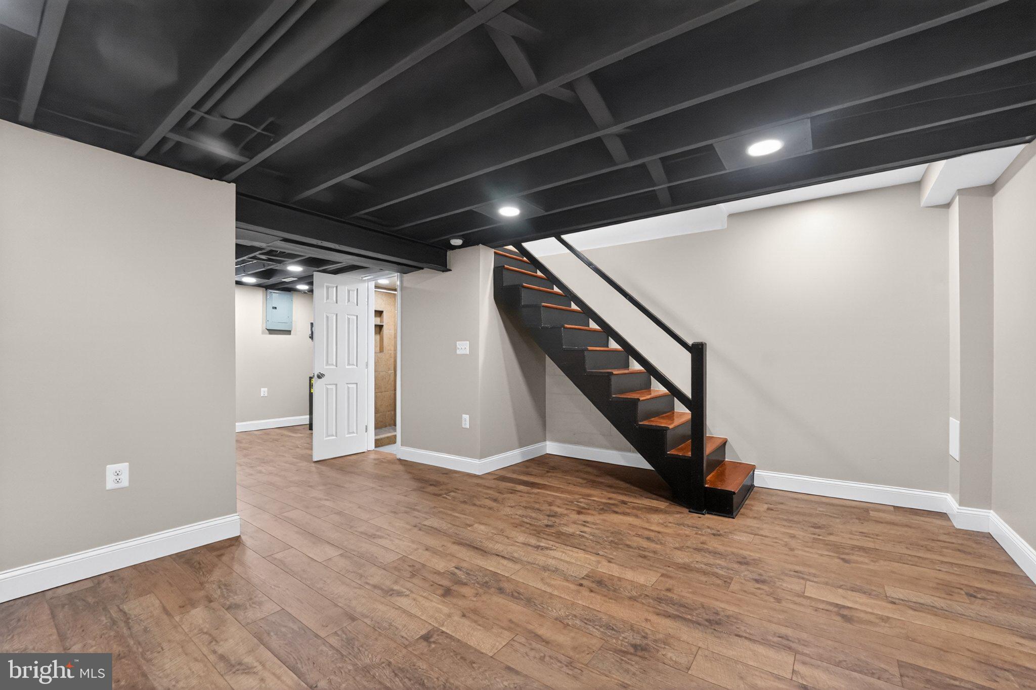 643 South Wickham Road Baltimore, MD 21229 - Photo 14 of 32 Modern basement with stylish staircase.