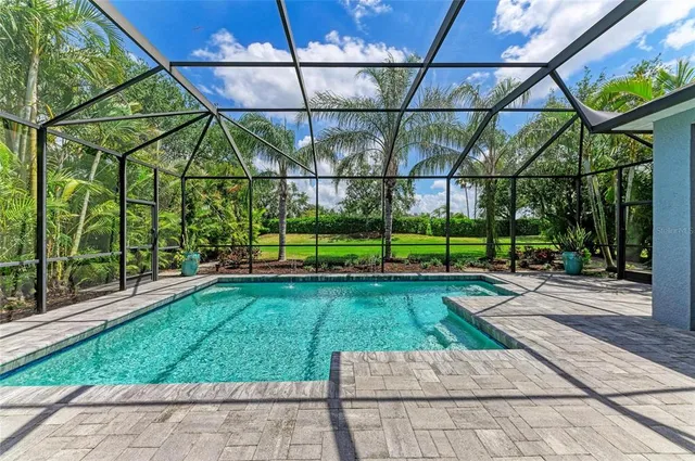 a view of a house with garden and a garden