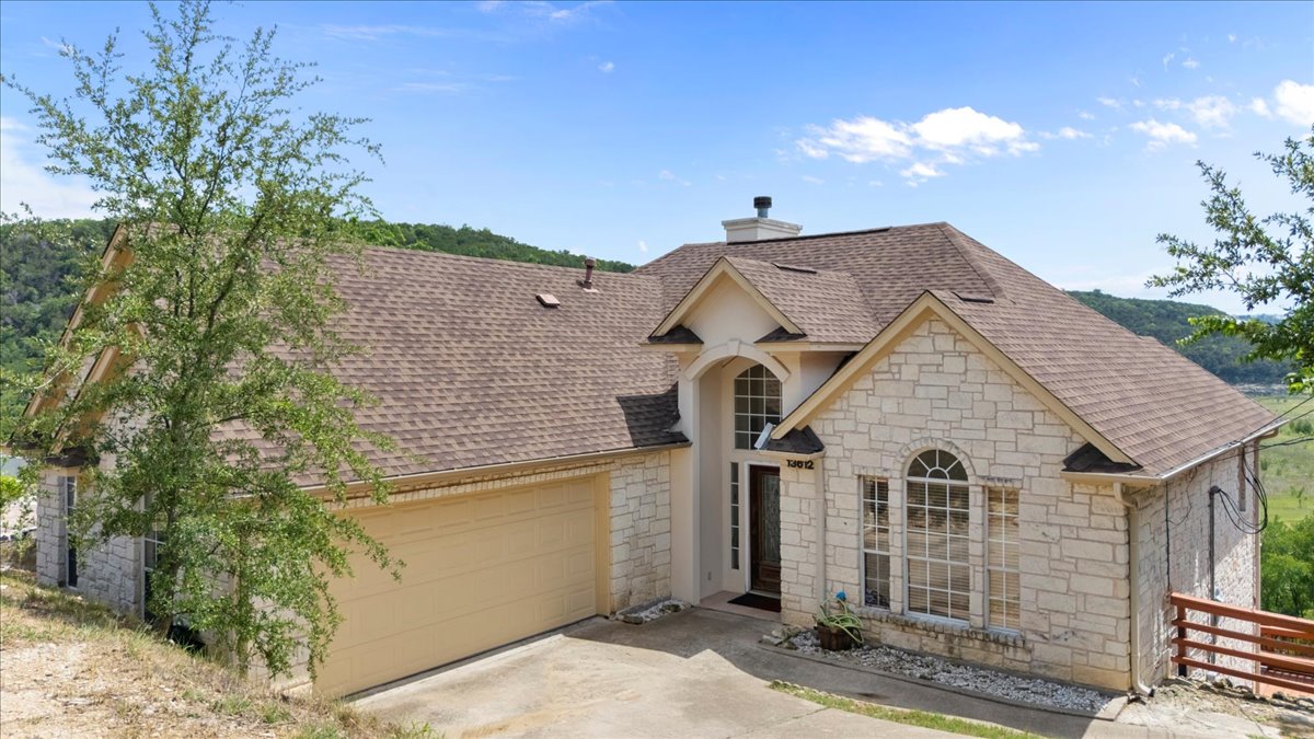 13612 Bullick Hollow Road Austin, TX 78726 - Photo 1 of 34 a view of a house with a yard