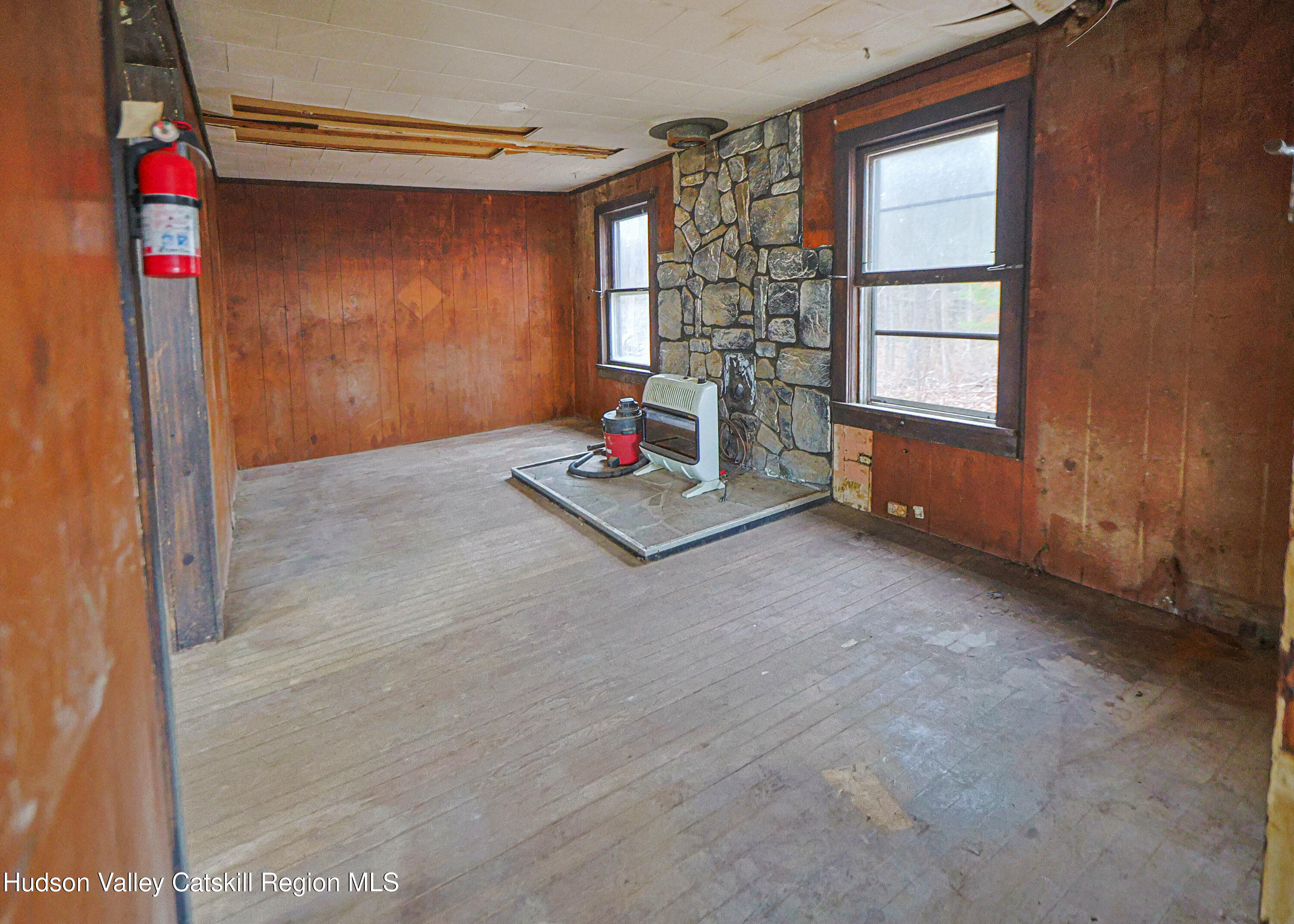 449 Spillway Road West Hurley, NY 12491 - Photo 11 of 42 a living room with furniture and a window
