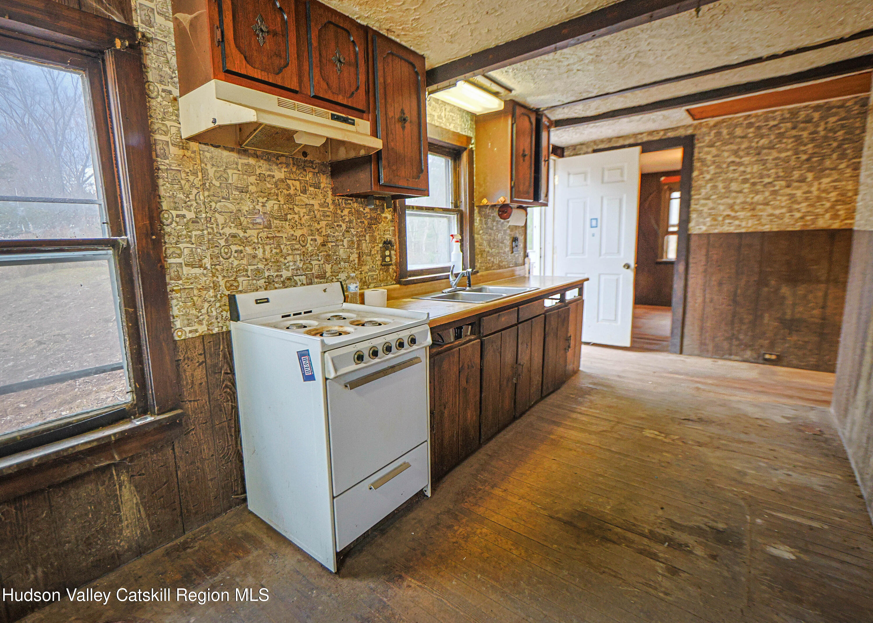 449 Spillway Road West Hurley, NY 12491 - Photo 13 of 42 a kitchen with stainless steel appliances granite countertop a stove a sink and a refrigerator