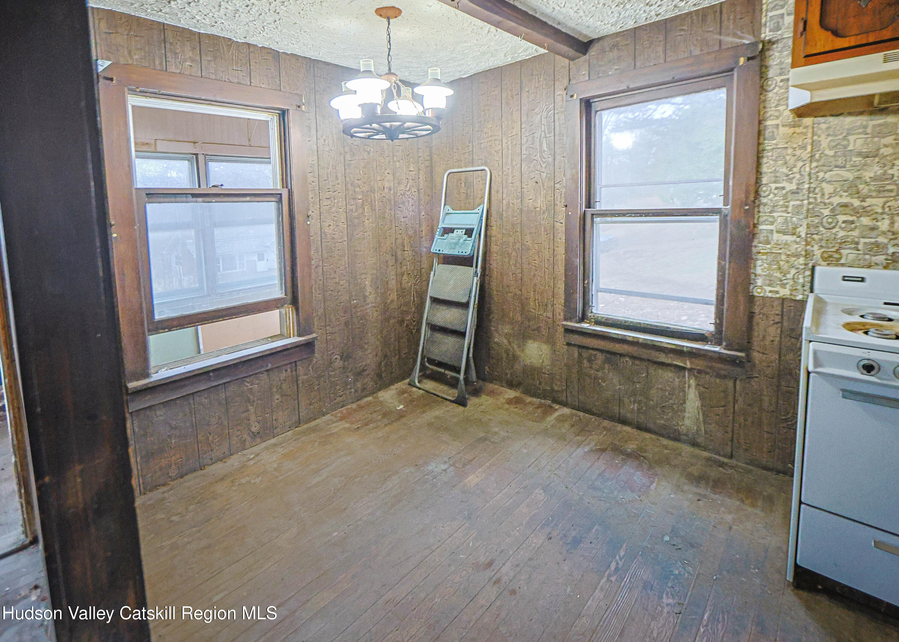 449 Spillway Road West Hurley, NY 12491 - Photo 19 of 42 an empty room with windows and entrance