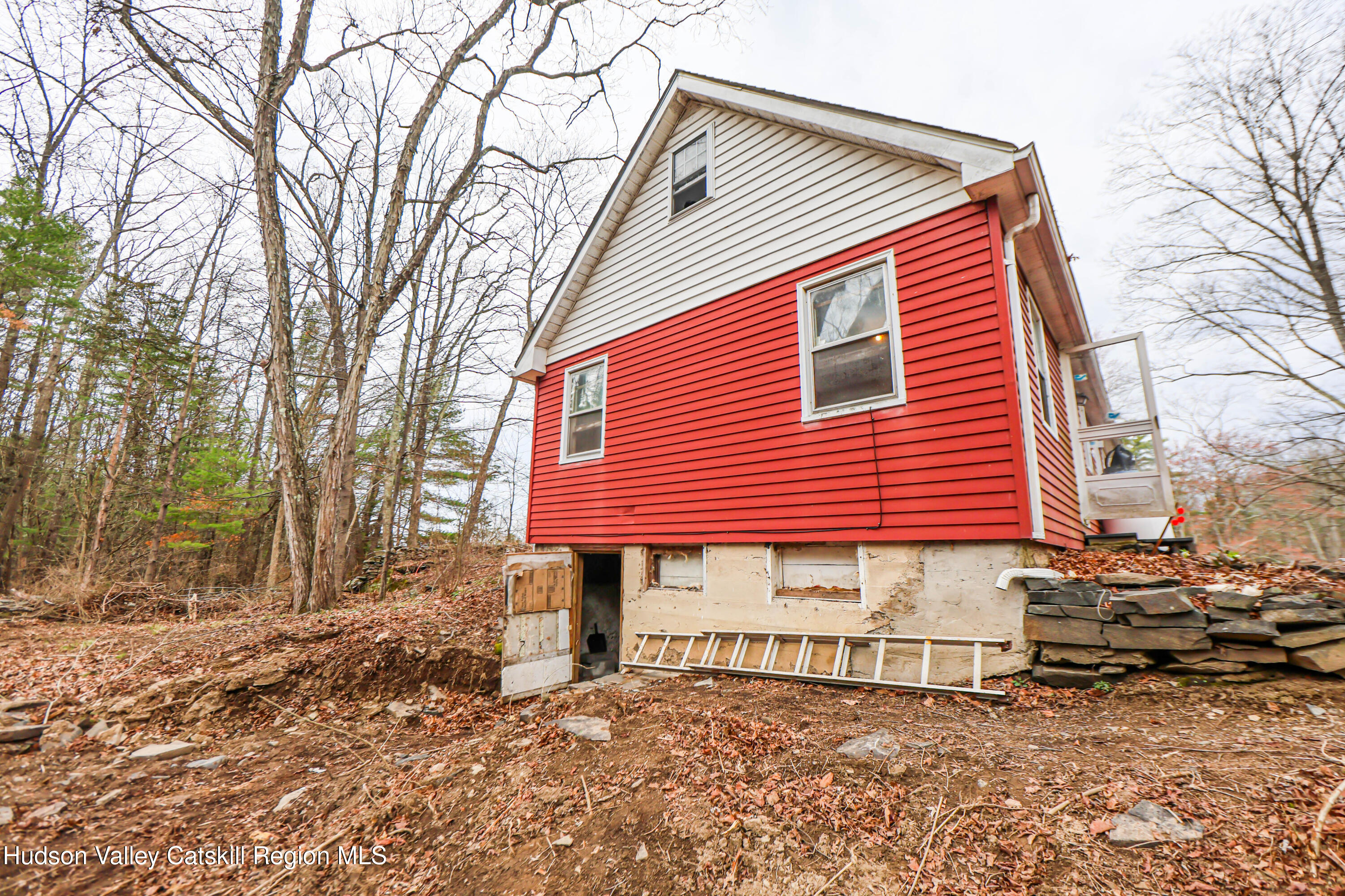 449 Spillway Road West Hurley, NY 12491 - Photo 3 of 42 a front view of a house with a yard