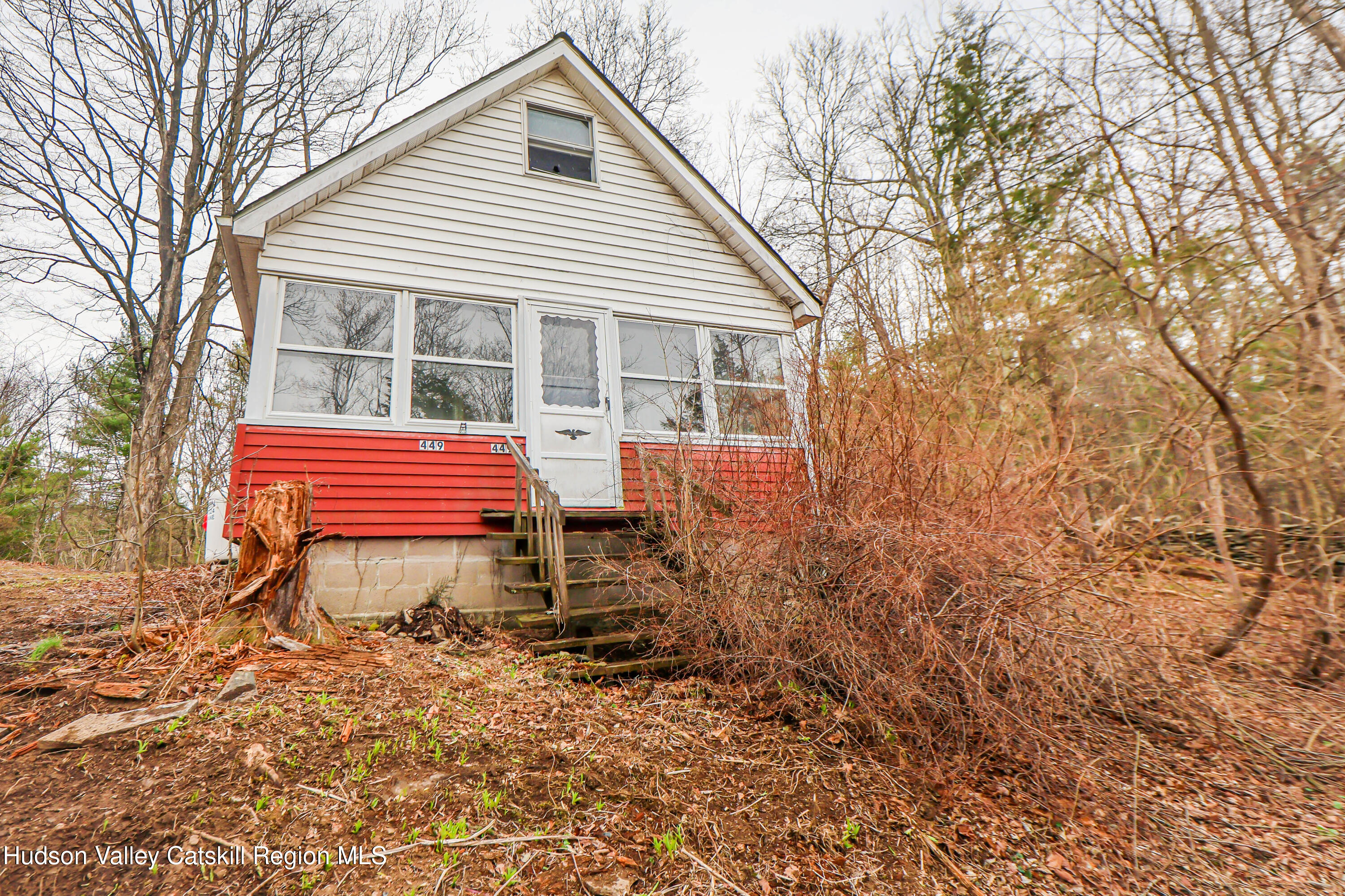 449 Spillway Road West Hurley, NY 12491 - Photo 9 of 42 a backyard of a house with wooden deck and barbeque oven
