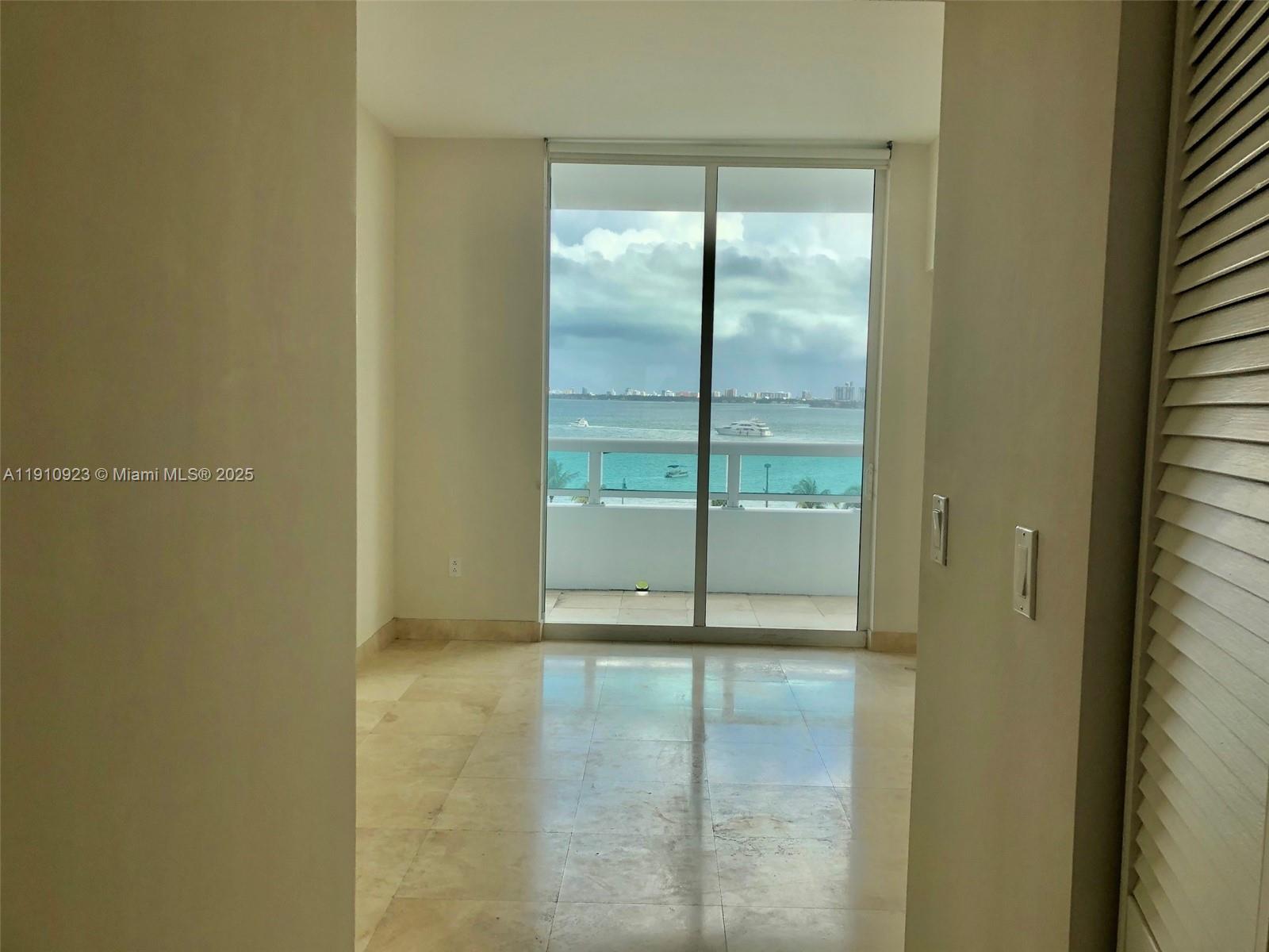1800 North Bayshore Drive, Unit 605 Miami, FL 33132 - Photo 12 of 48 a window in an empty room