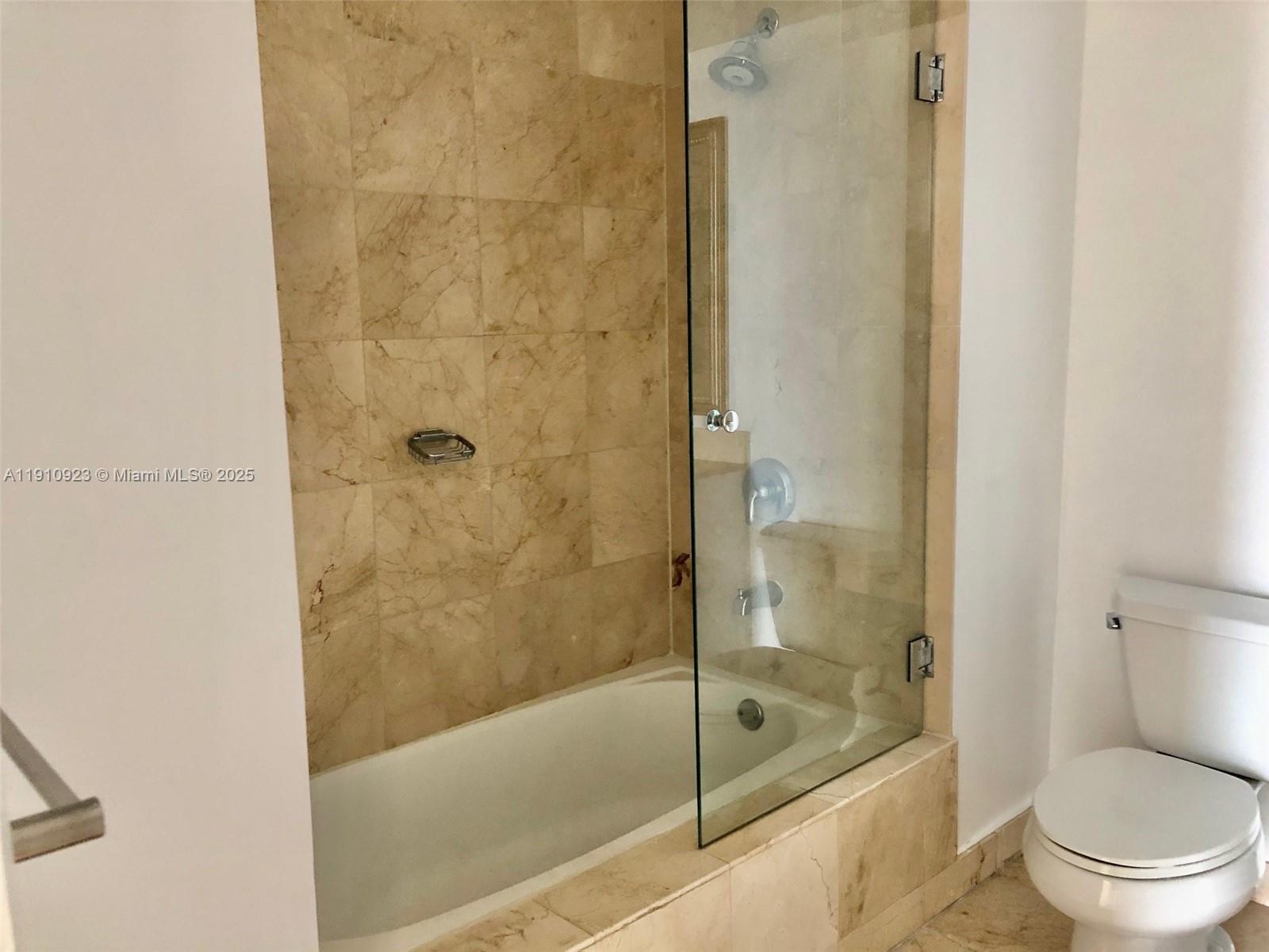 1800 North Bayshore Drive, Unit 605 Miami, FL 33132 - Photo 14 of 48 a bathroom with a shower and a toilet