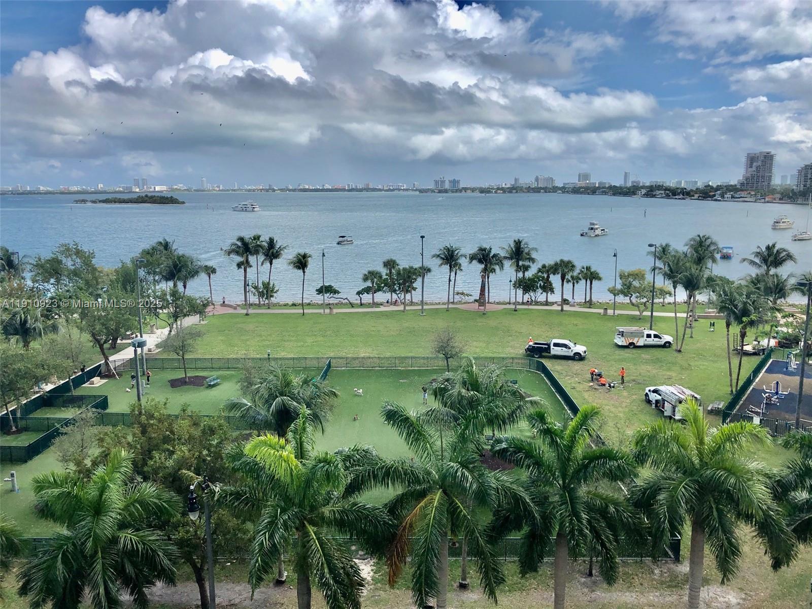 1800 North Bayshore Drive, Unit 605 Miami, FL 33132 - Photo 2 of 48 a view of a lake with a yard