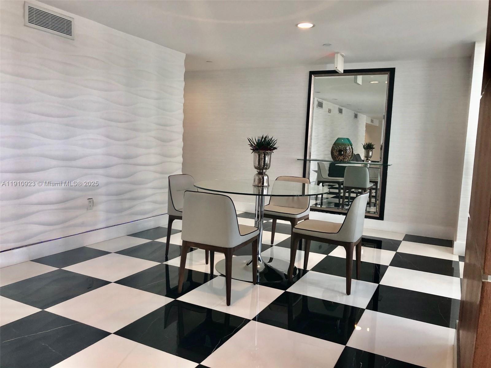 1800 North Bayshore Drive, Unit 605 Miami, FL 33132 - Photo 26 of 48 a living room with a black white checkered floor with a black white checkered floor