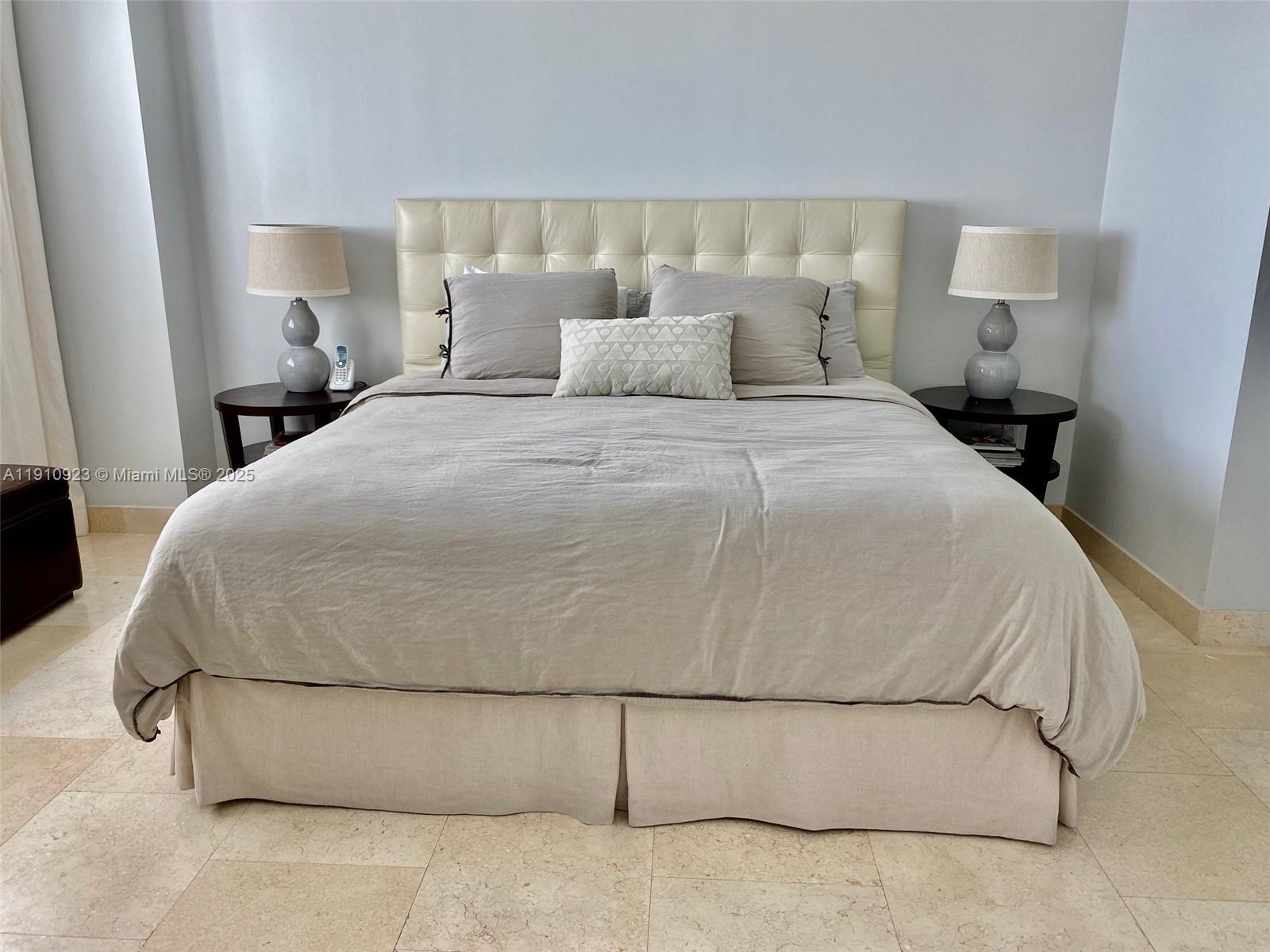 1800 North Bayshore Drive, Unit 605 Miami, FL 33132 - Photo 7 of 48 a large white bed in a white room