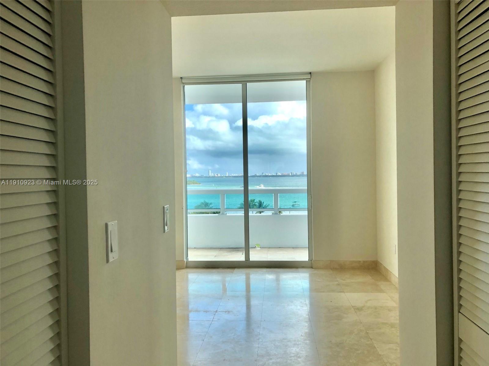 1800 North Bayshore Drive, Unit 605 Miami, FL 33132 - Photo 10 of 48 a bathroom with a glass door shower