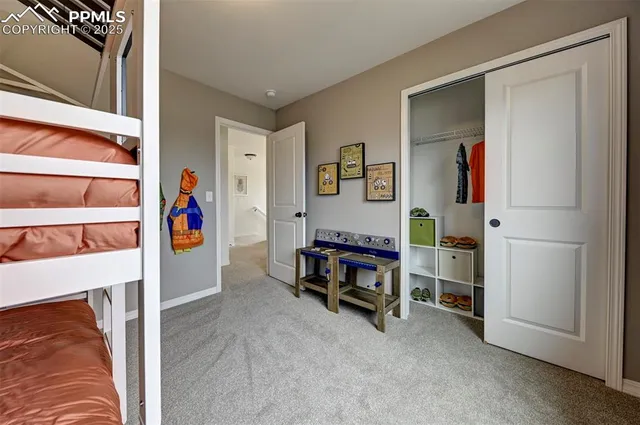 a view of a livingroom with furniture and closet