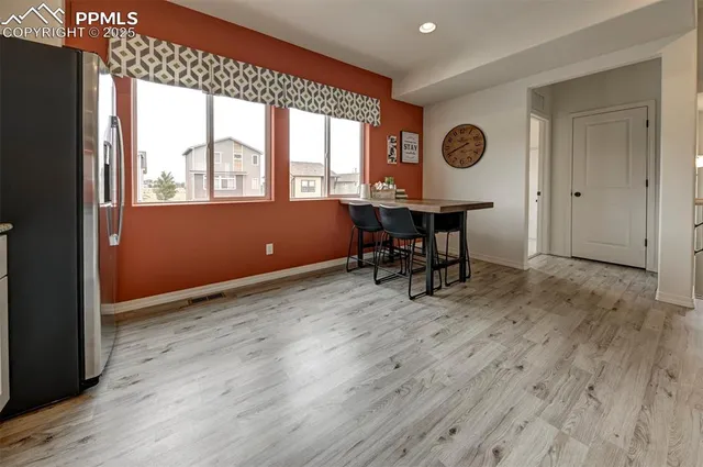 a view of room with a window and wooden floor