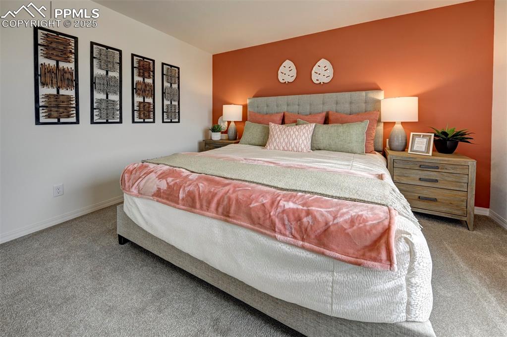 7311 Cornice Point Colorado Springs, CO 80923 - Photo 26 of 32 a bedroom with a bed and window