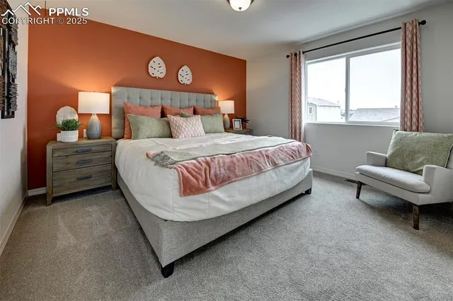 a bed room with a bed and a couch