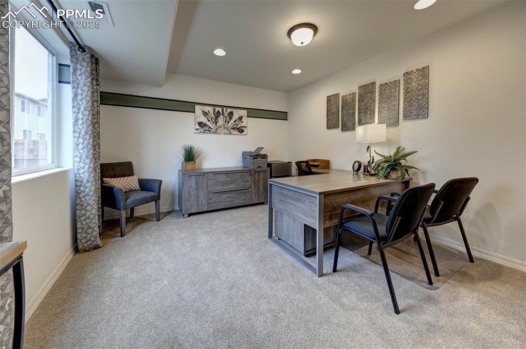 7311 Cornice Point Colorado Springs, CO 80923 - Photo 8 of 32 a dining room with furniture and window