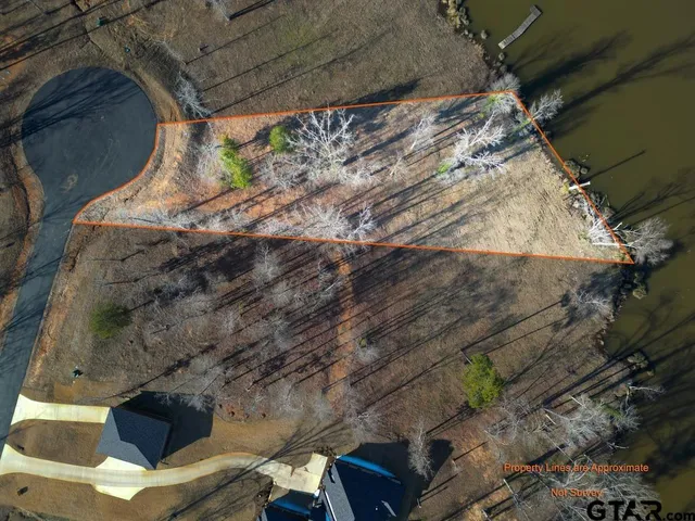 a view of a backyard with outdoor seating