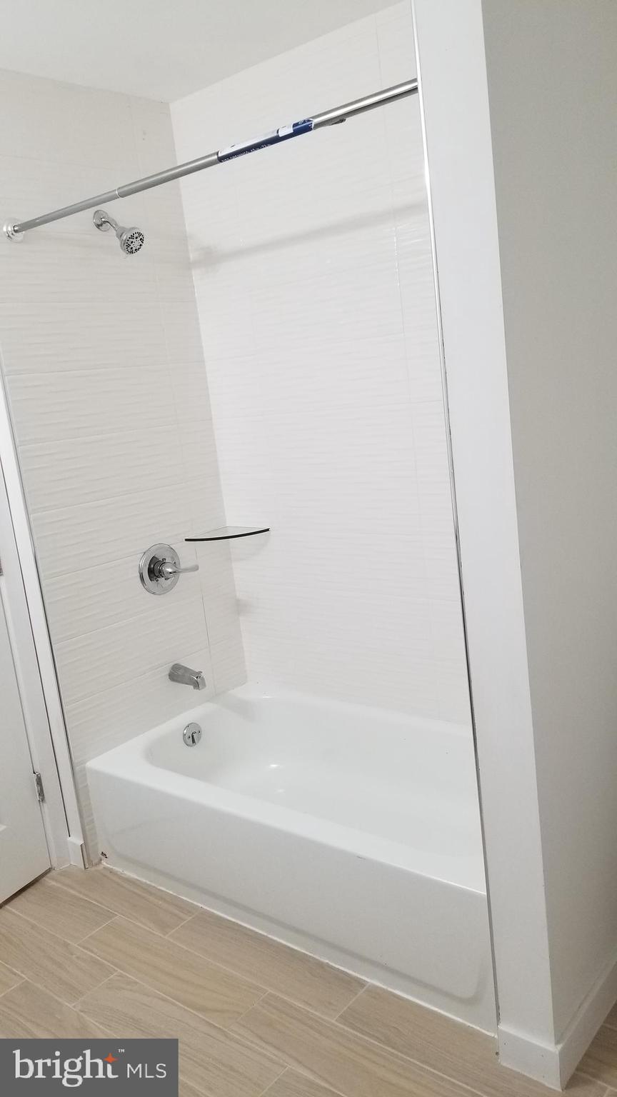 247 South 16th Street, Unit 5 Philadelphia, PA 19102 - Photo 8 of 10 a bathroom with a bathtub