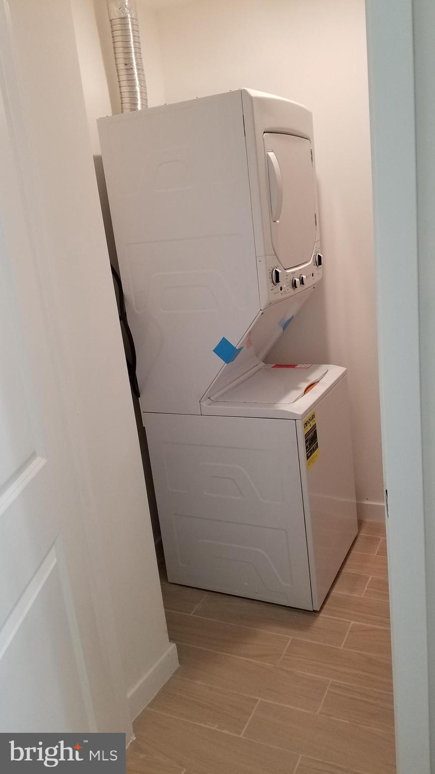 247 South 16th Street, Unit 5 Philadelphia, PA 19102 - Photo 9 of 10 a utility room with dryer and washer