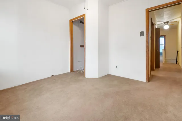 a view of a wooden deck with a yard