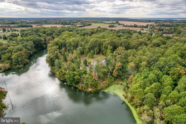 an aerial view of a house with outdoor space